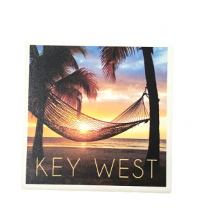 Key West sunset with a hammock hanging on palm trees and the words KEY WEST on the bottom